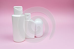 Set of white plastic cosmetic bottles and deodorant mock-up.