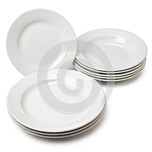 Set of white plates isolated on white background