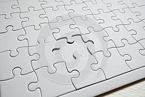 Set of white puzzle pieces and last one piece