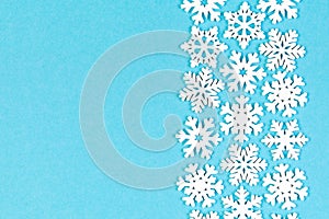 Set of white snowflakes on colorful background. Top view of Christmas ornament. New Year time concept with empty space for your