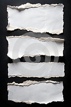 Set of White Torn Paper Sheets on Black Background