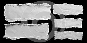 Set of White Torn Paper Sheets on Black Background
