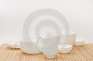 Set of white utensils on a support