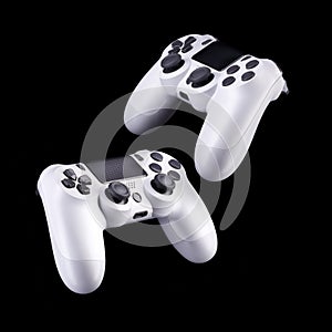 Set of white video game joysticks gamepad isolated on a black background