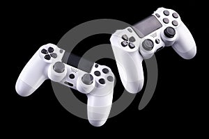 Set of white video game joysticks gamepad isolated on a black background