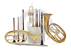 Set of wind musical instruments on white background