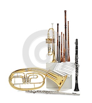 Set of wind musical instruments on white background