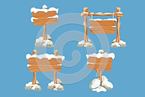 Set winter old wooden blank, signboard with snow in cartoon style.Empty frames, direction plank isolated on blue photo