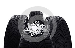 Set of winter tires with snowflake on white background, closeup