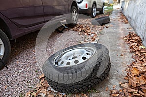 Set of winter wheels and tyres replacing on car