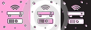 Set Wireless multimedia and TV box receiver and player with remote controller icon isolated on pink and white, black