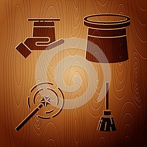 Set Witches broom, Magician hat in hand, Magic wand and Magician hat on wooden background. Vector