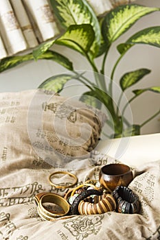 Set of wooden bracelets on a pillow