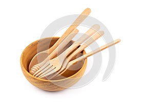 Set of wooden cutlery in Wicker baskets isolated on a white back