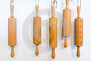 Set of wooden rolling pins on white background
