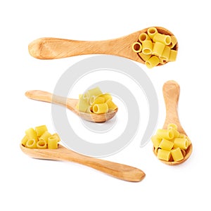 Set of wooden spoon filled with dry ditalini pasta over isolated white background