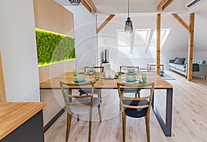 Set wooden table in modern dining room.