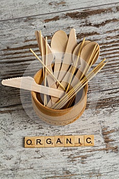 Set of wooden utensil tools and organic word.