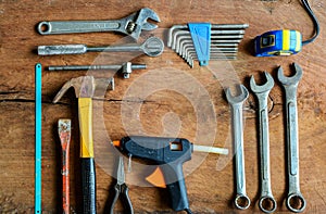 Set of work tools on old grunge wood background