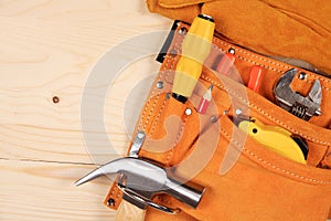 Set of working tools on wooden background