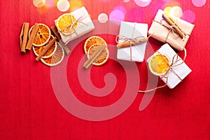 Set of wrapped boxes with presents decorated cinnamon,  slices dried oranges