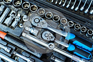 A set of wrenches of different sizes and shapes. Car mechanic tools in a small case. Close-up