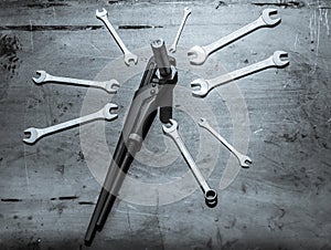 A set of wrenches on steel sheet
