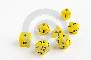 Set of yellow dices for rpg, dnd, tabletop or board games on light background