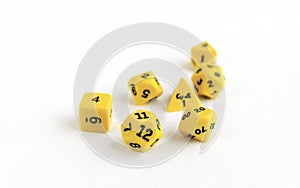 Set of yellow dices for rpg, dnd, tabletop or board games on light background