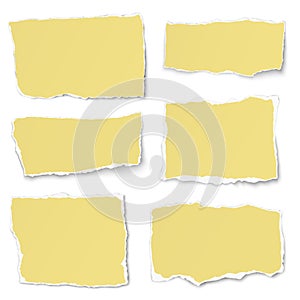 Set of yellow paper different shapes tears isolated on white background