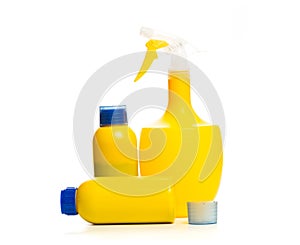 Set of yellow plant sprayer  and fertilizer for ripening in the bottle isolated on white background