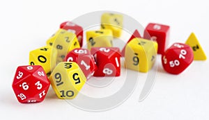Set of yellow and red dices for rpg, dnd or board games on light background