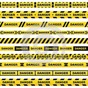 Set of yellow ribbons with black lettering danger skull and stripes indicating dangerous place on a white background. Safety polic