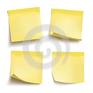Set of yellow sheets of note papers. Four sticky notes. Vector photo
