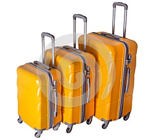 A set of yellow suitcases on wheels. Baggage. Travel suitcase isolated on white background
