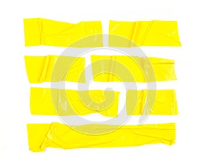 Set of yellow tapes on white background. Torn horizontal and different size yellow sticky tape, adhesive pieces