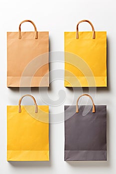 Set of yellow tones paper bag mock-up isolated on white.
