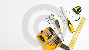 Set of yellow tools top view. men`s hobby flat lay isolated on white background.