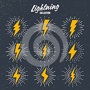 Set of yellow vintage lightning bolts and sunrays on grunge background. Lightnings with sunburst effect. Thunderbolt