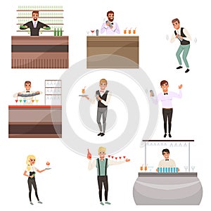 Set of young bartenders standing at the bar counter surrounded with bottles and glasses. Barmen mixing, pouring and