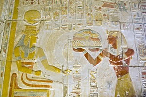 Seti offering food to the goddess Hathor photo