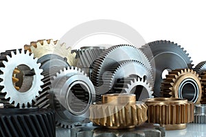 Sets of gears, cogwheels made of steel and brass isolated on white background with shadow reflection. Helical and spur gears,some photo