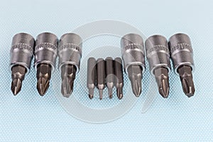 Sets of interchangeable crosspoint bits for screwdriver and mini screwdriver