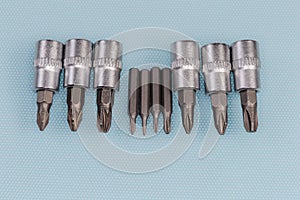 Sets of interchangeable crosspoint bits for screwdriver and mini screwdriver