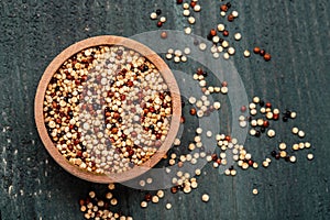 Sets quinoa seeds on a wooden bowl. Healthy and diet superfood product. Long banner format, top view