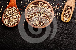 Sets quinoa seeds on a wooden bowl. Healthy and diet superfood product. Long banner format, top view