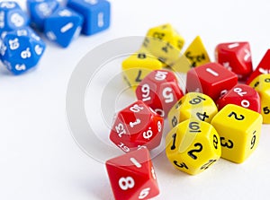 Sets of yellow, blue and red dices for rpg, dnd or board games on white background