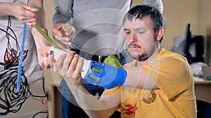 Setting artificial limb on the amputated hand.