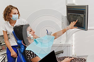 Setting and determining bite and position of jaws with the help of a device with a neuromuscular stimulator. Myo-monitor in the de