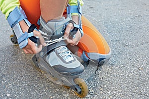 Setting of laces on black roller skates.